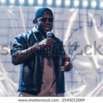 rap-artist-performing-on-vibrant-600w-2545012009 (1)